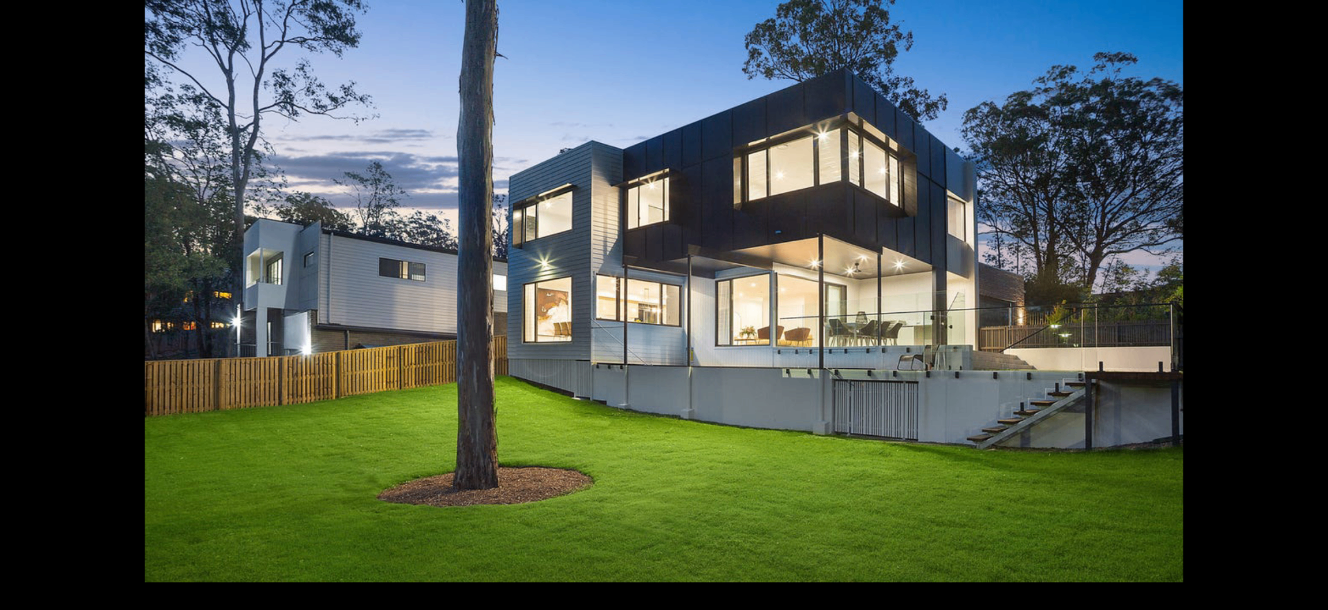 3 Ruth Miller Close — rear elevation and lawn at dusk